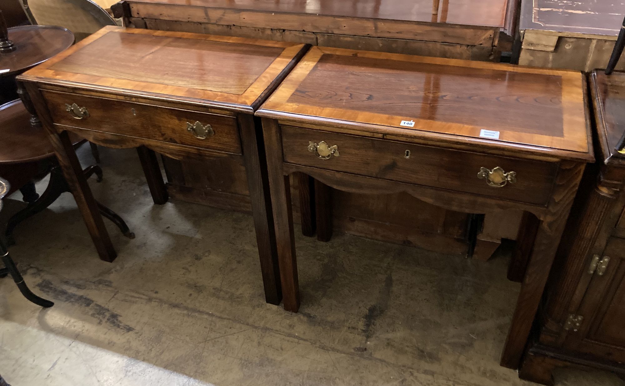 A pair of George III style cross banded oak side tables, width 80cm, depth 45cm, height 82cm